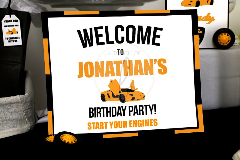 Orange supercar party welcome sign
