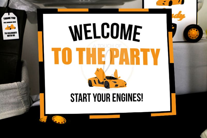 orange exotic car party welcome sign